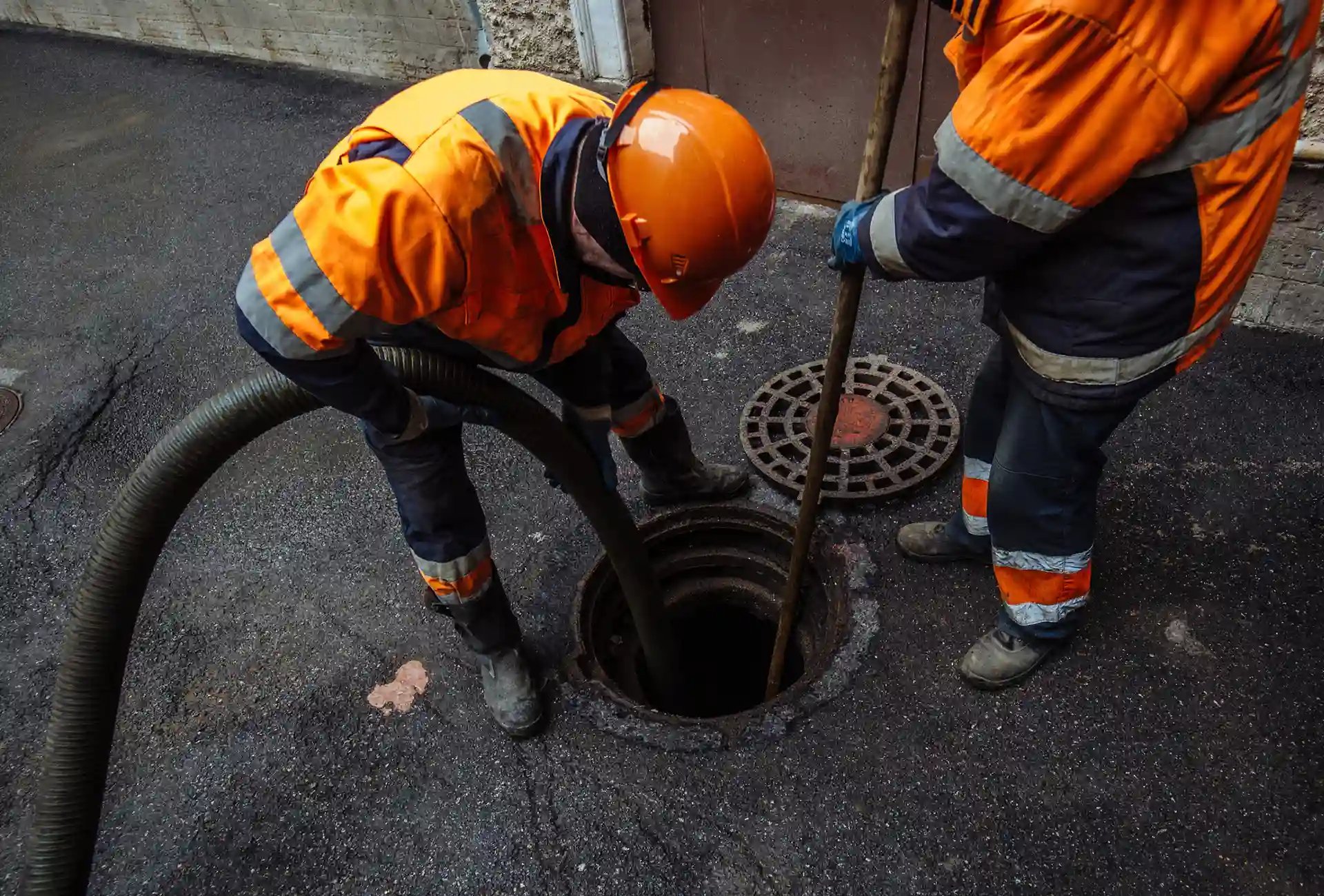 Gully cleaning team cleaning gully