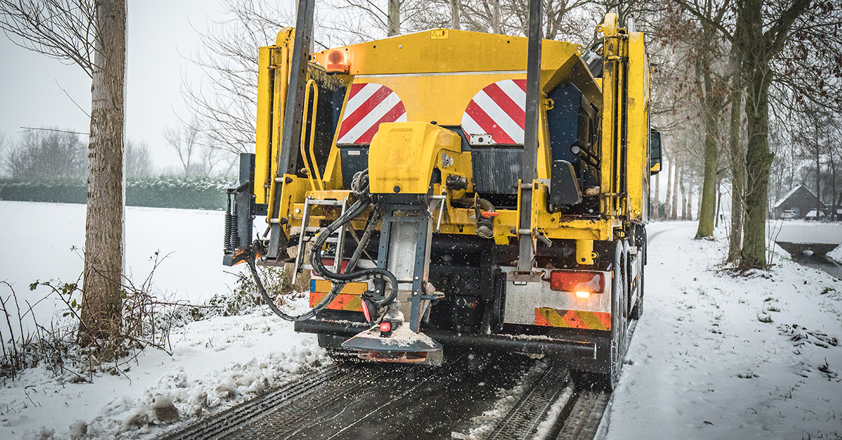 Municipal winter service truck spreading salt to prevent icy roads
